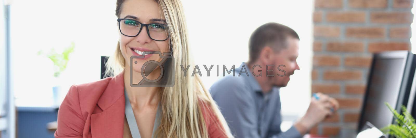 Royalty free image of Smiling and professional company worker by kuprevich