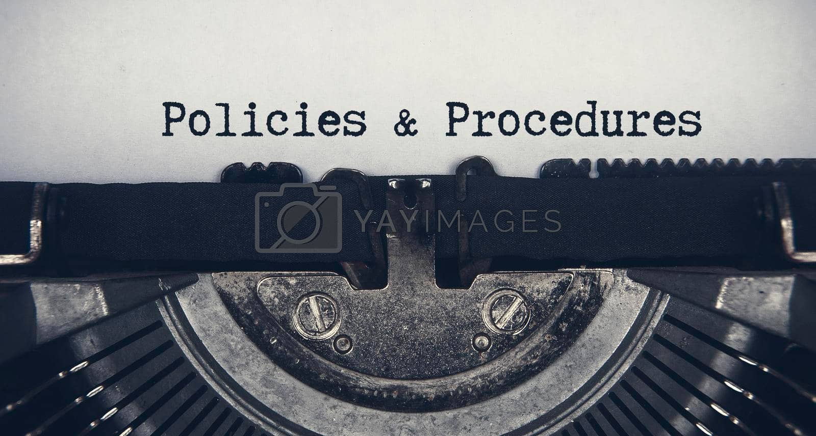 Royalty free image of Policies and procedures text typed on an old vintage typewriter. Rules concept by yom98