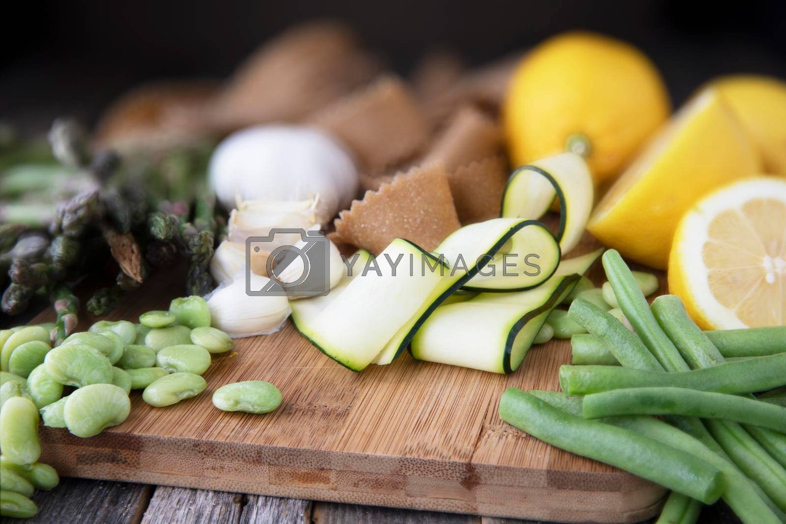 Royalty free image of Fresh vegetables and Raw Pasta by charlotteLake