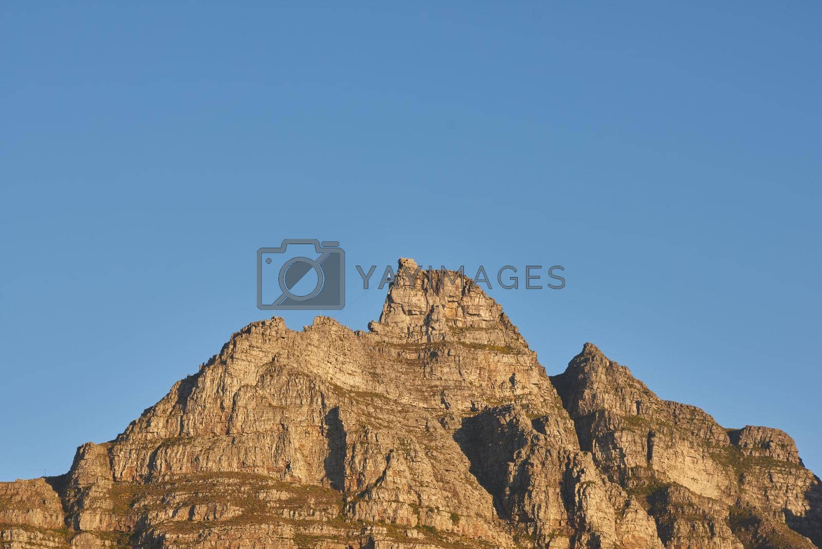 Copyspace with scenic landscape of a mountain peak against a clear blue sky on a sunny day. Scenic view of Table Mountain in Cape Town, South Africa in summer. Wide angle view of a nature background.