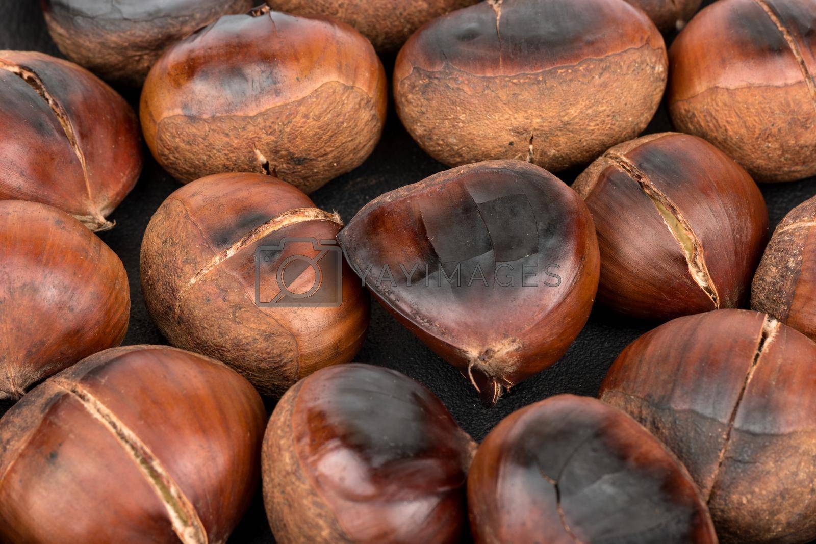 Royalty free image of Roasted edible chestnuts by andregric
