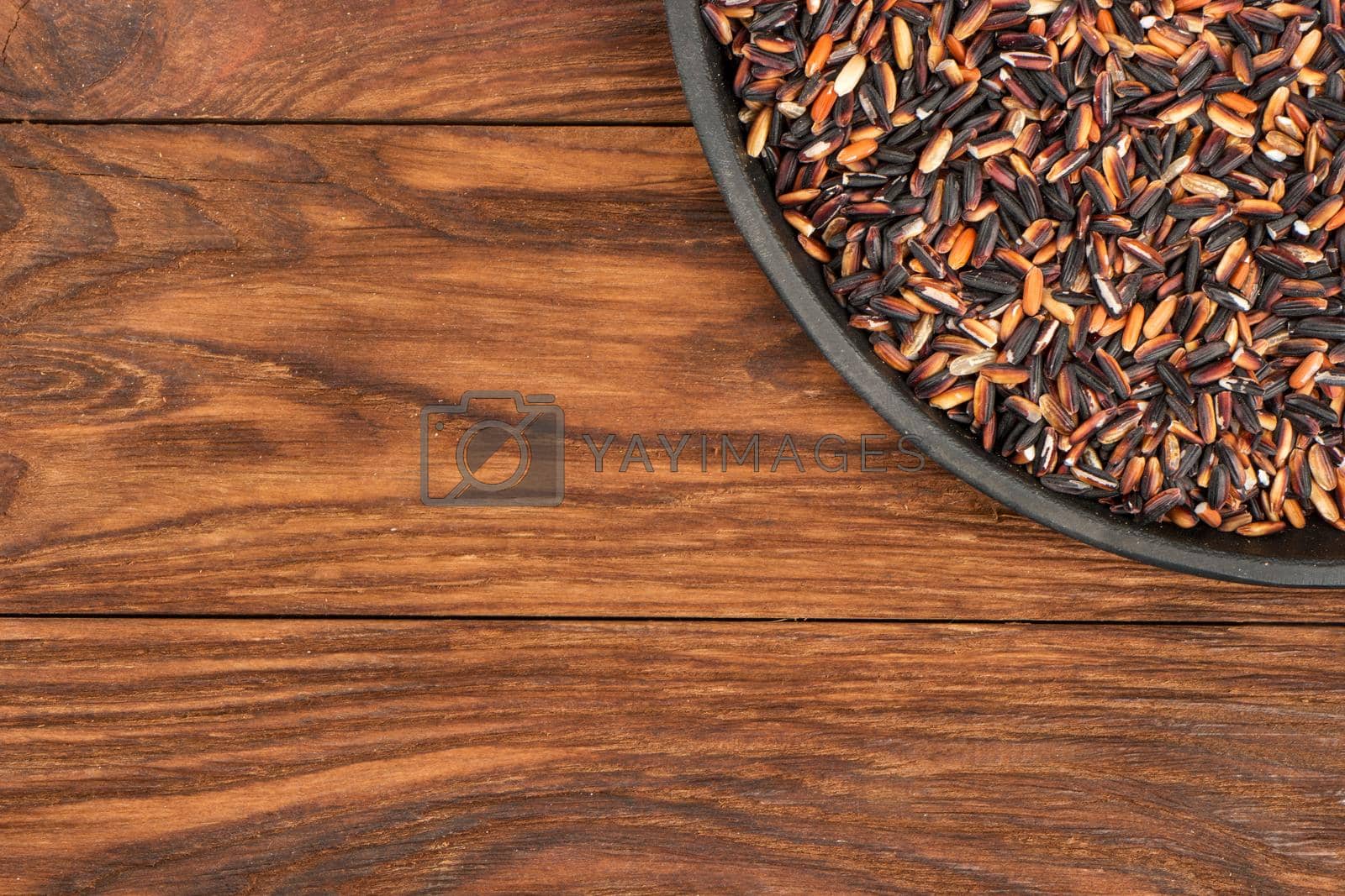Royalty free image of Black rice in pan by andregric