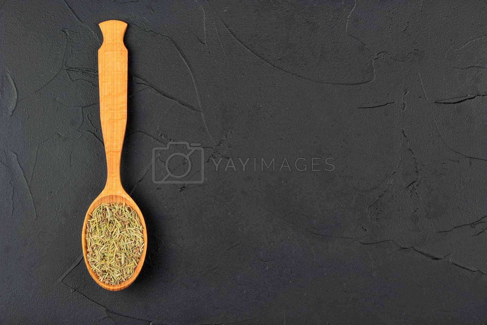 Royalty free image of Dry rosemary in a spoon by andregric