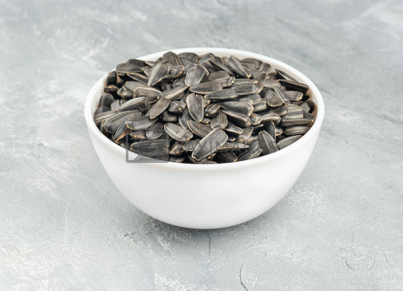 Royalty free image of Sunflower seeds in bowl by andregric