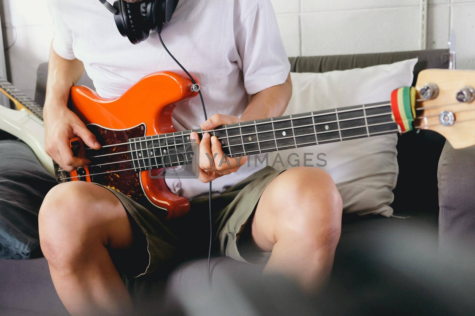 Royalty free image of Musician playing bass guitar by ponsulak