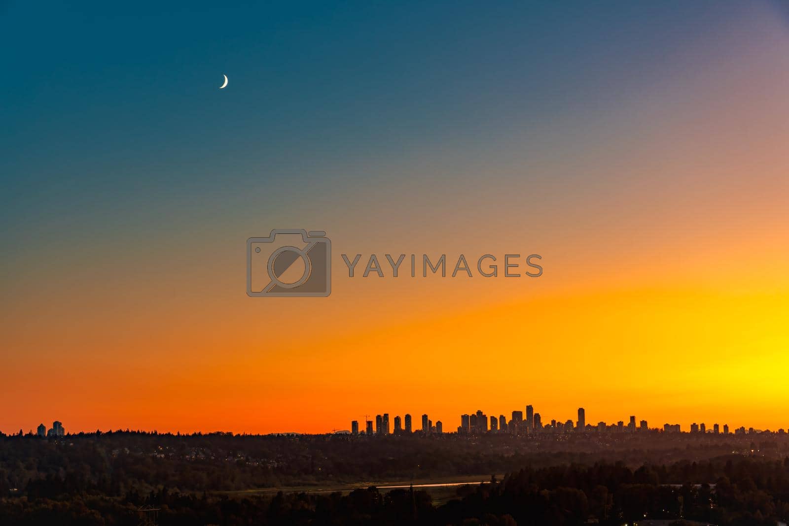 Royalty free image of Metrotown district under the moon on sunset sky background by Imagenet
