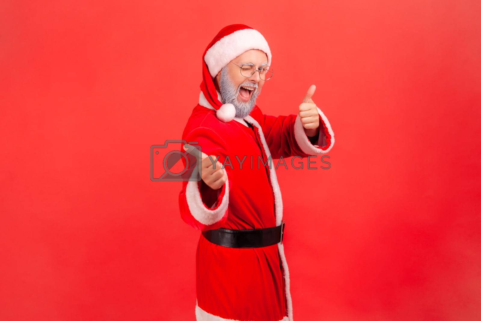 Royalty free image of Emotional aged santa clause on red background. by Khosro1