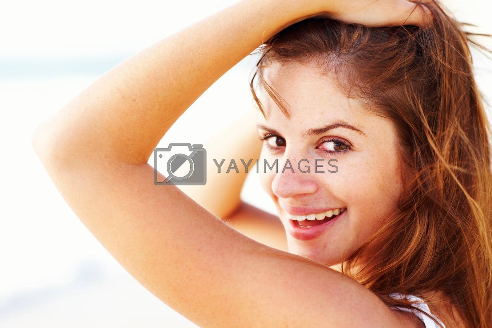 Royalty free image of Portrait of happy young lady posing. Closeup portrait of a happy young lady posing. by YuriArcurs