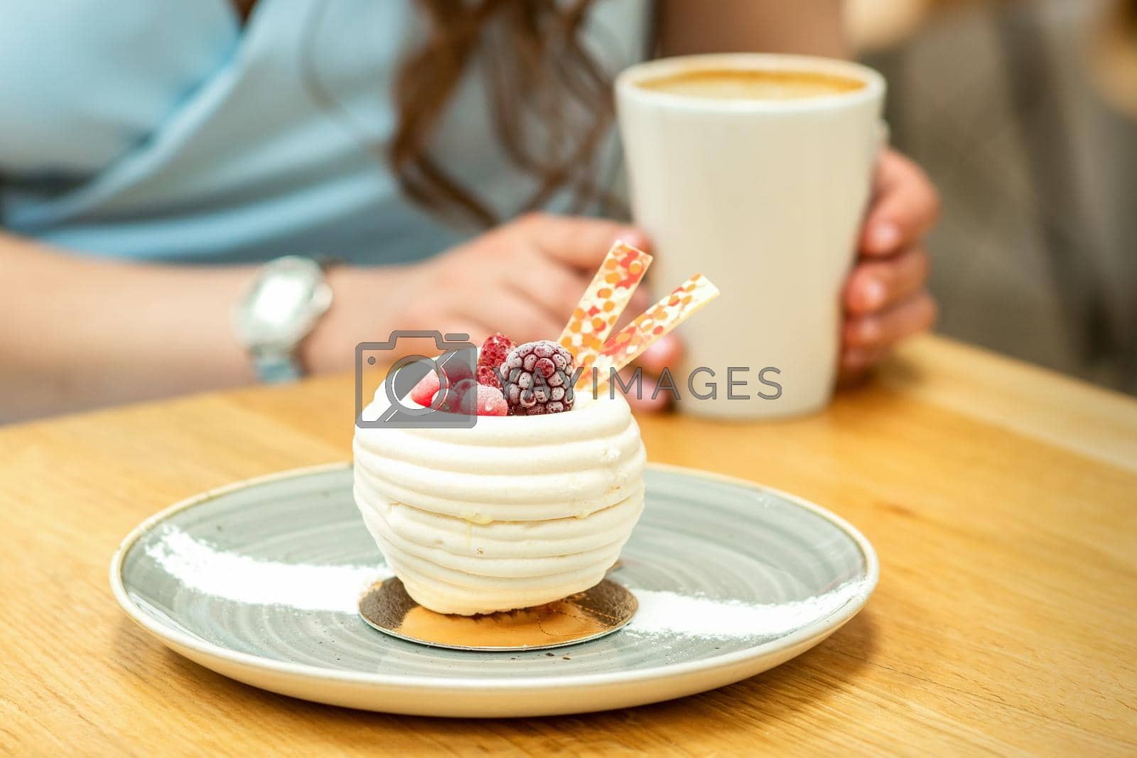 Royalty free image of Sweet white cupcake with berries by okskukuruza