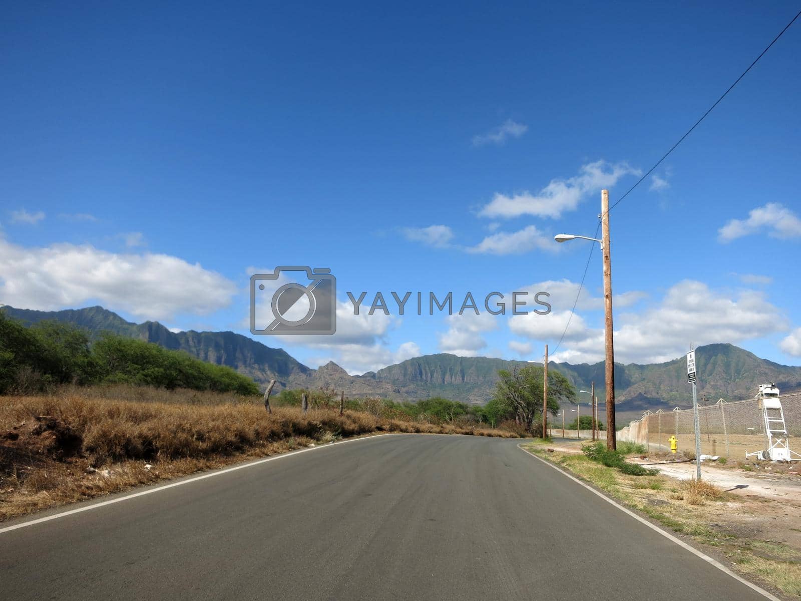 Royalty free image of Long empty road in Maili Valley by EricGBVD