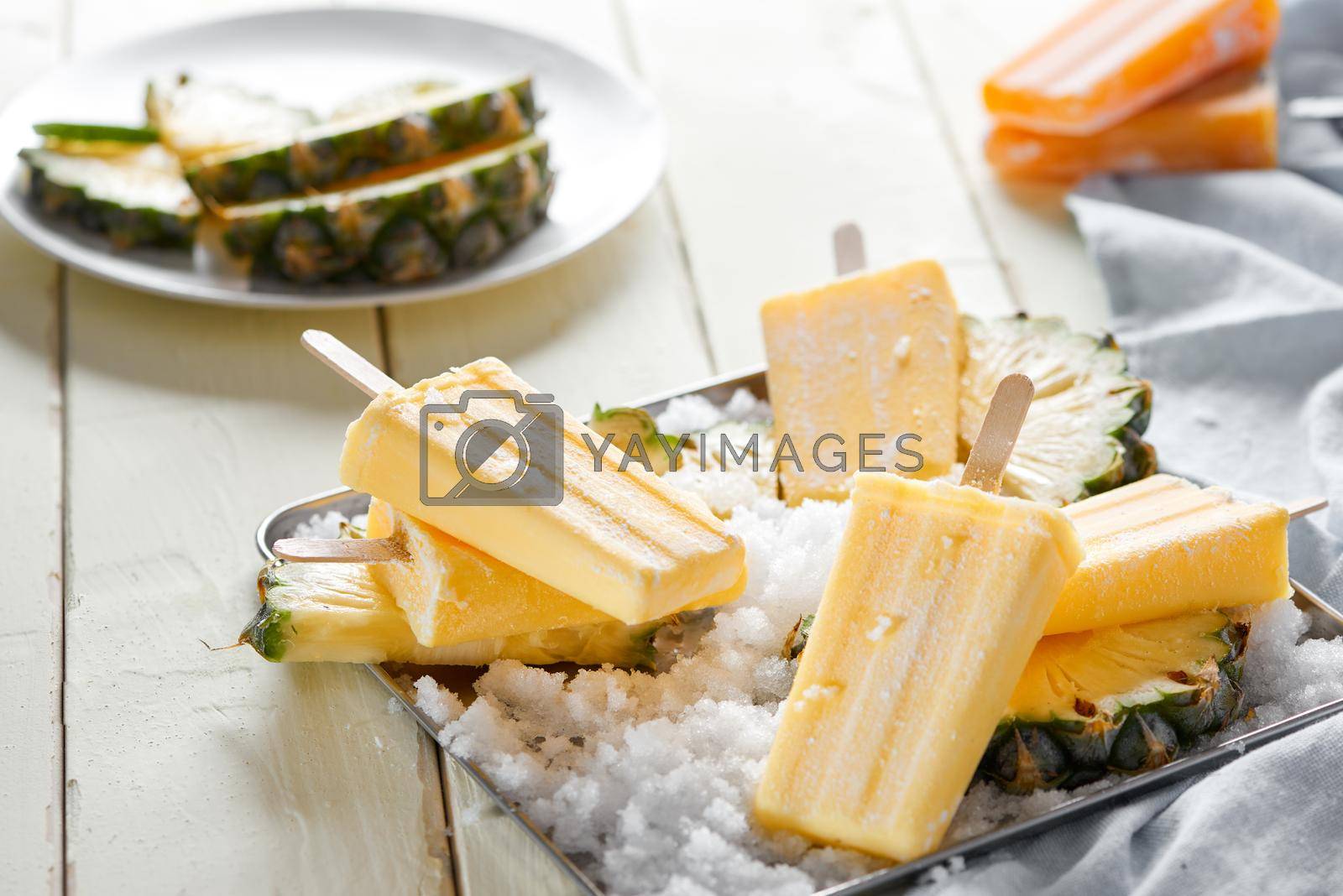 Royalty free image of Homemade popsicles with lemon and mint on a wooden table by makidotvn