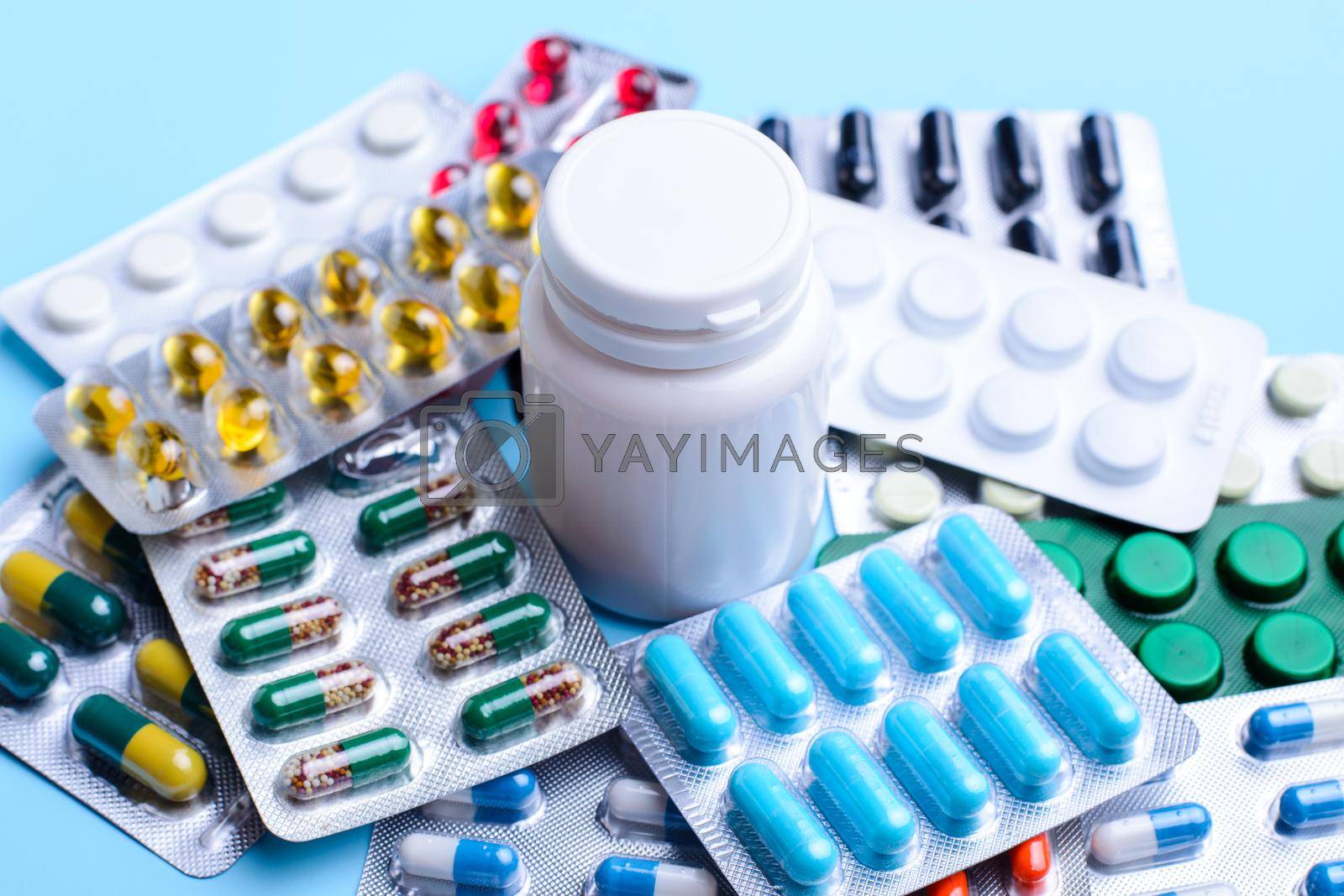 Royalty free image of Pills and capsules of different size and colour by VitaliiPetrushenko