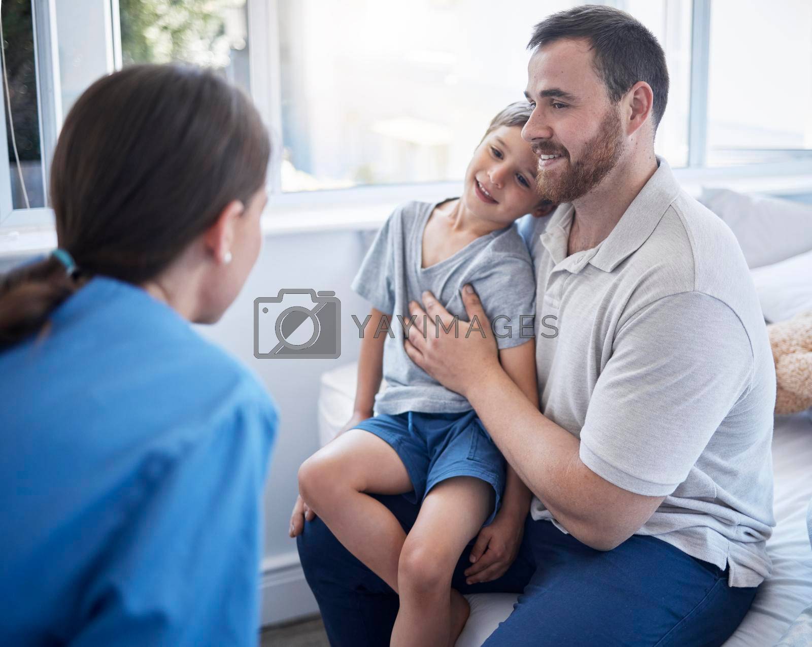 Royalty free image of Hes the healthiest little boy. a female doctor doing a checkup on a sick little boy at home. by YuriArcurs