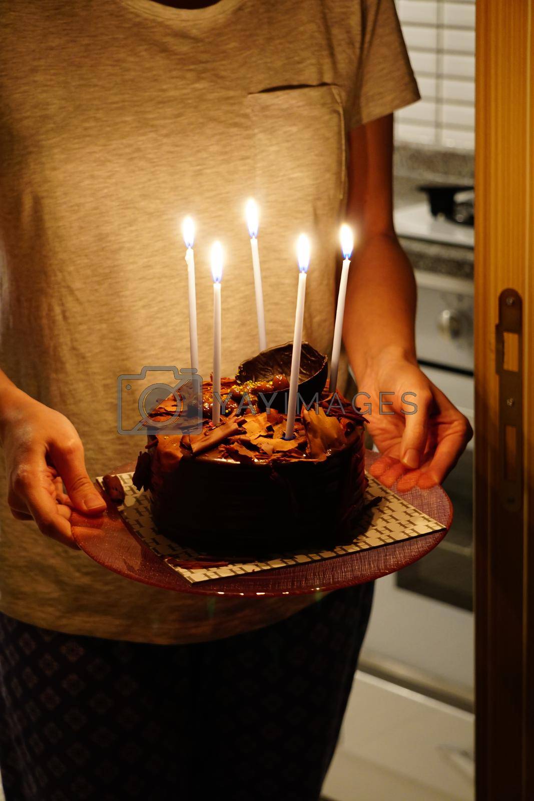 Birthday celebration chocolate cake with candles on