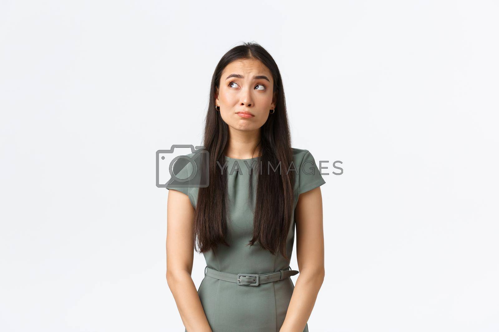 Royalty free image of Small business owners, women entrepreneurs concept. Indecisive timid asian female worried about starting own startup, looking confused and doubtful, gazing upper left corner hesitant by Benzoix