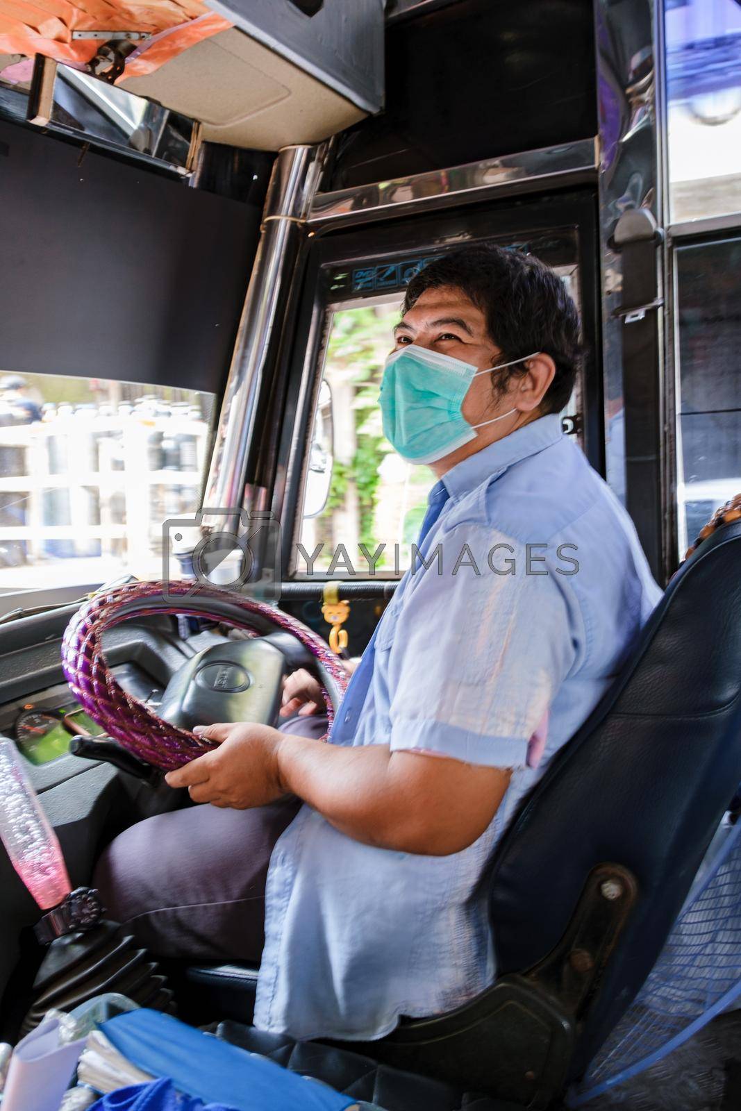 Bangkok Thailand July 2022 people with mas in a red bus public transport during covid 19 pandemic. people using public transport with face mask