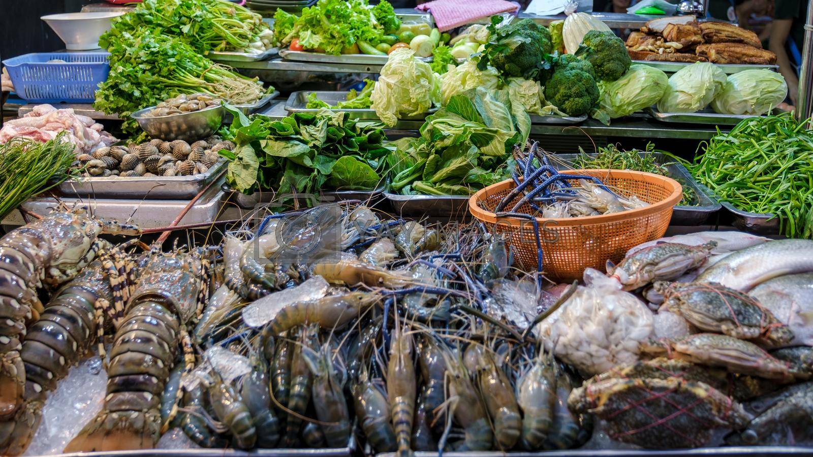 Royalty free image of China town Bangkok Thailand, colroful streets vegetable market with greens and fish Bangkok by fokkebok