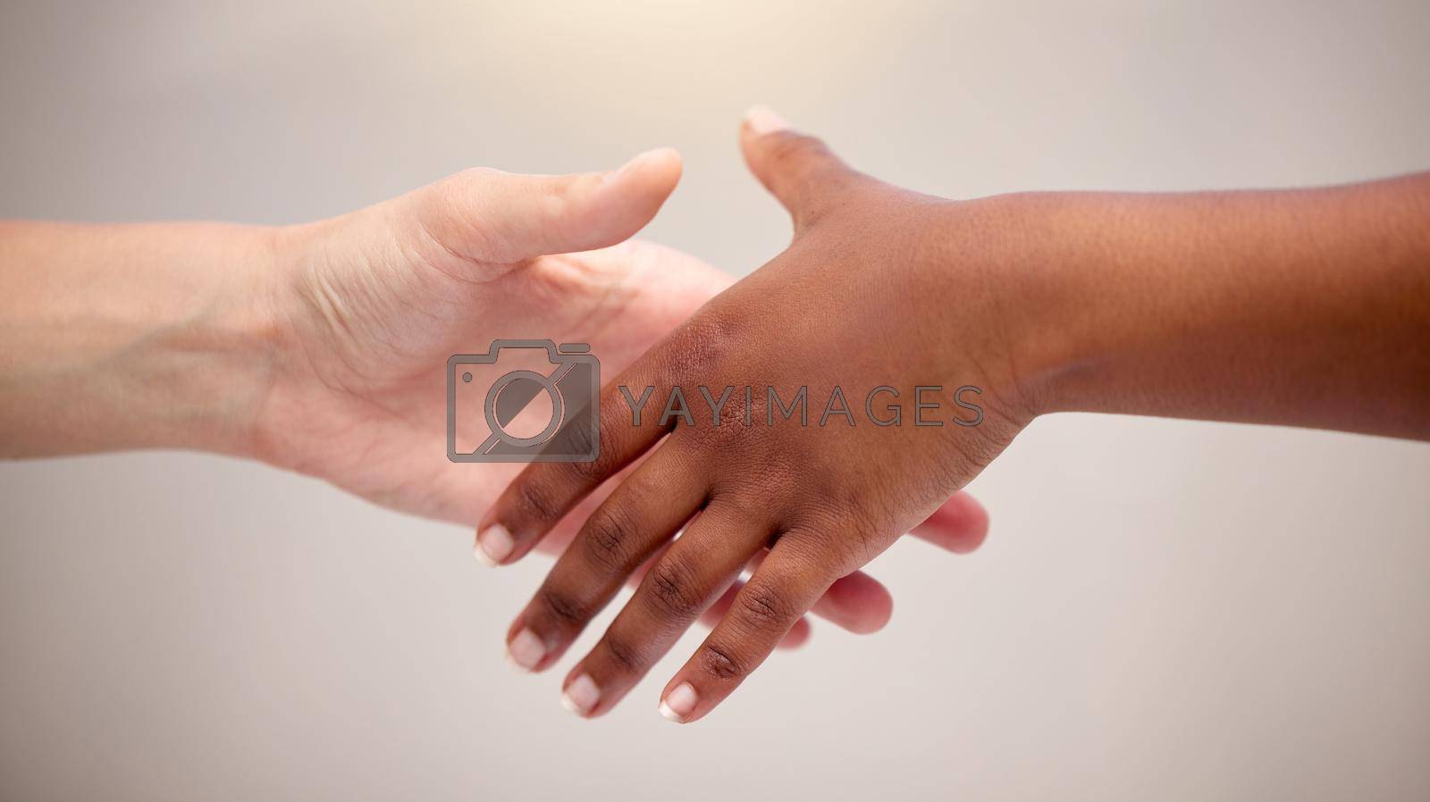 Royalty free image of Reaching out to loved ones. two people reaching for one another. by YuriArcurs