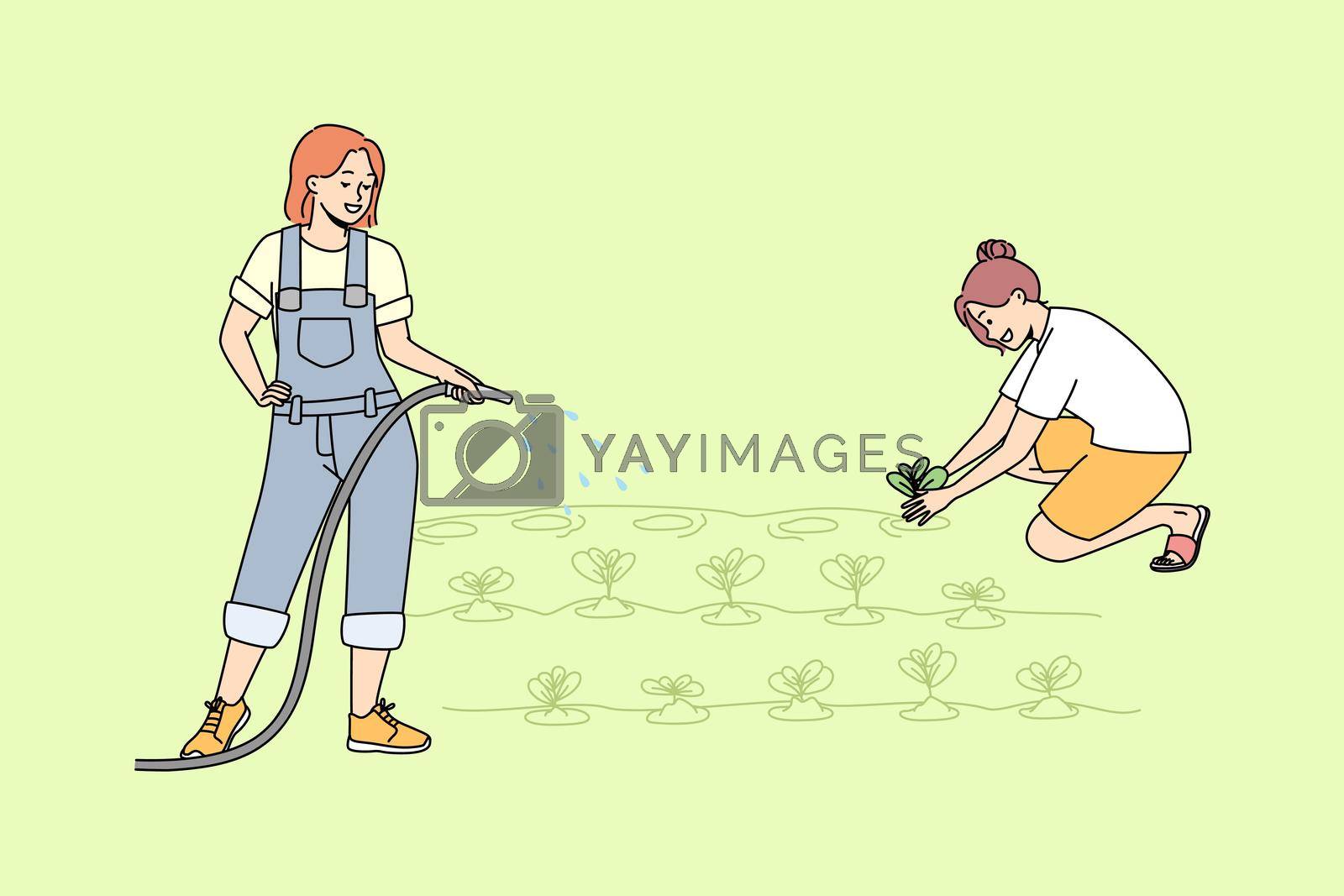 Royalty free image of Women working in garden together by VECTORIUM
