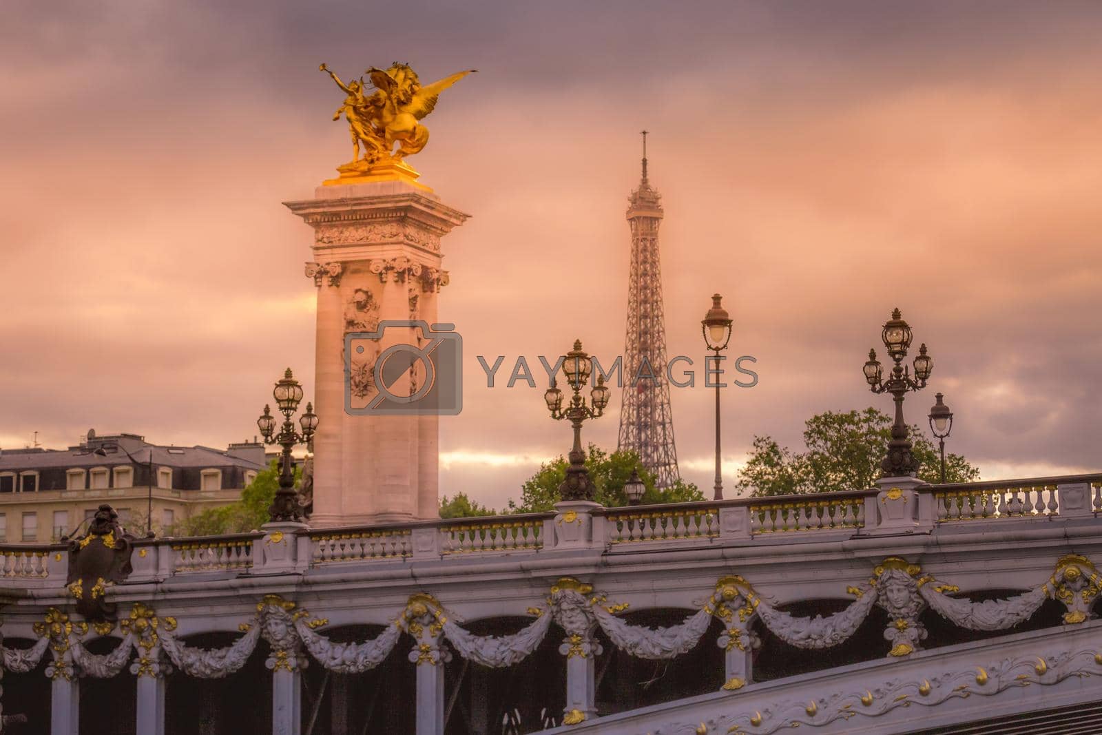 Royalty free image of Eiffel Tower and Pont Alexandre III at dramatic sunset, Paris, france by positivetravelart