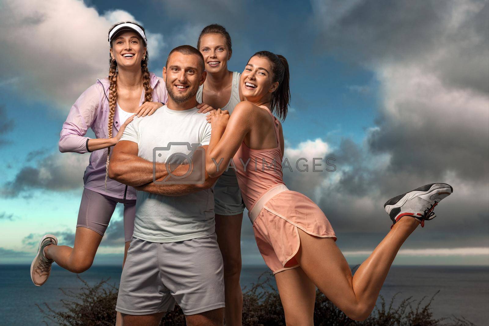 Royalty free image of Certified group exercise instructor and his team. Premium high resolution photo Smiling women and man fitness team. A happy group of runners rest after running. by MikeOrlov