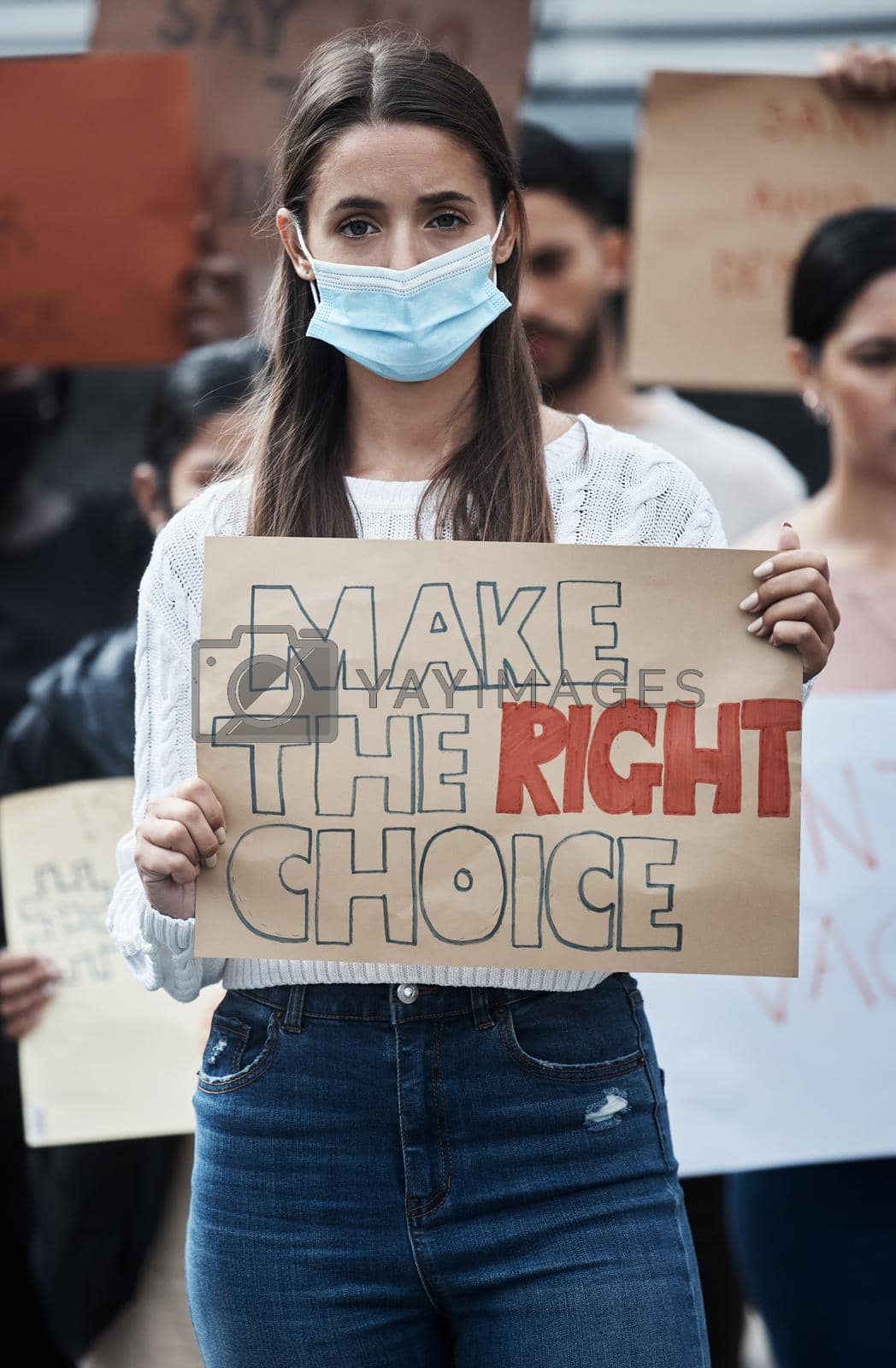 Royalty free image of Making the choice for us is wrong. a young woman protesting at a covid vaccine march. by YuriArcurs