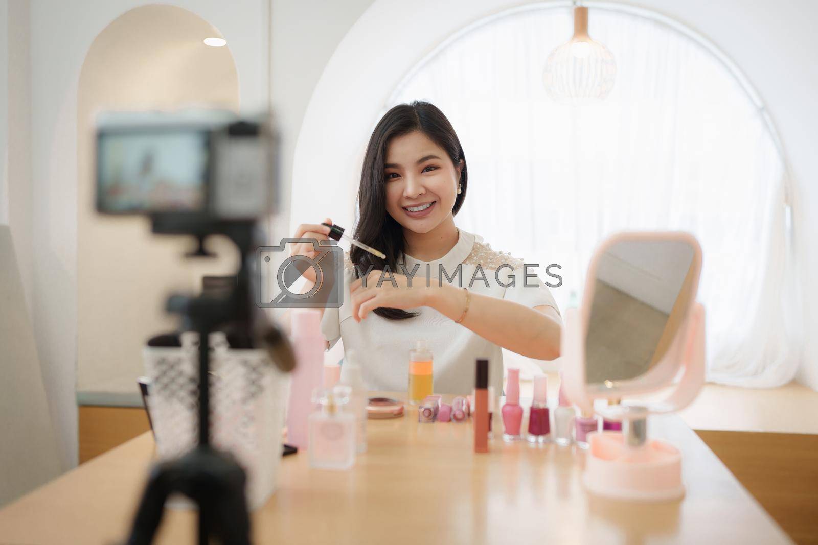 Royalty free image of Professional beauty make up artist vlogger live stream makeup tutorial by itchaznong