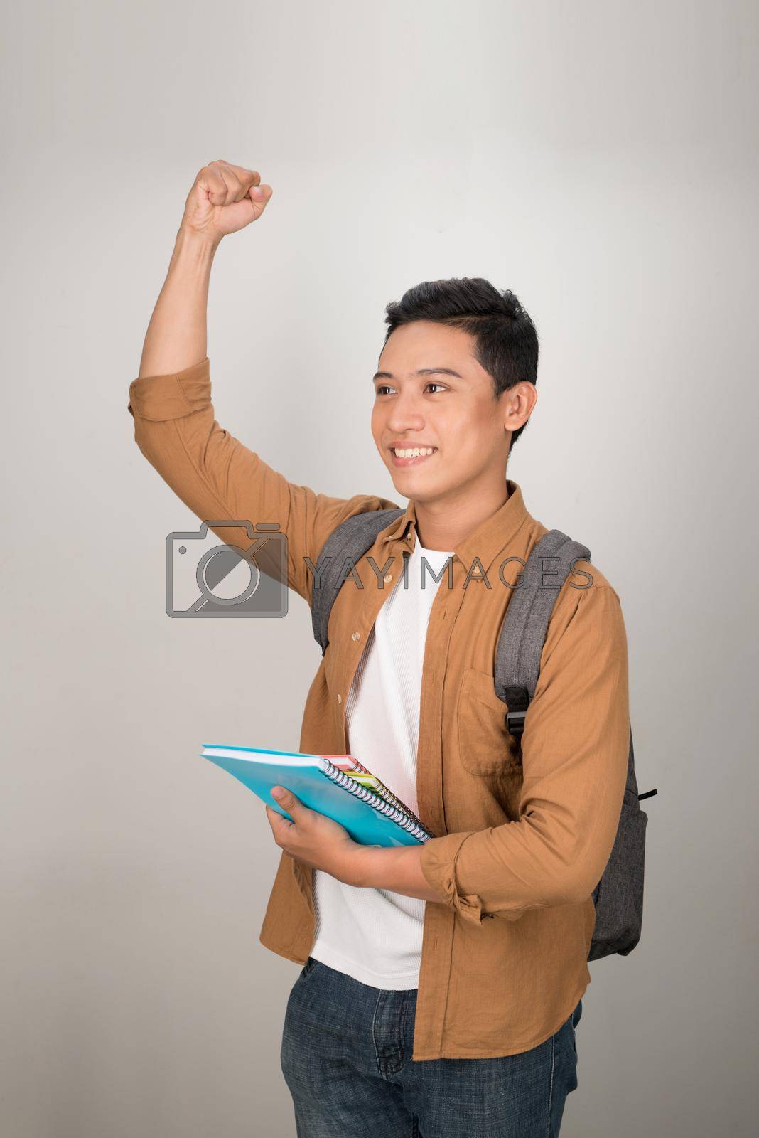 Royalty free image of Handsome Asian excited student happy smile looking at camera, isolated on white background by makidotvn