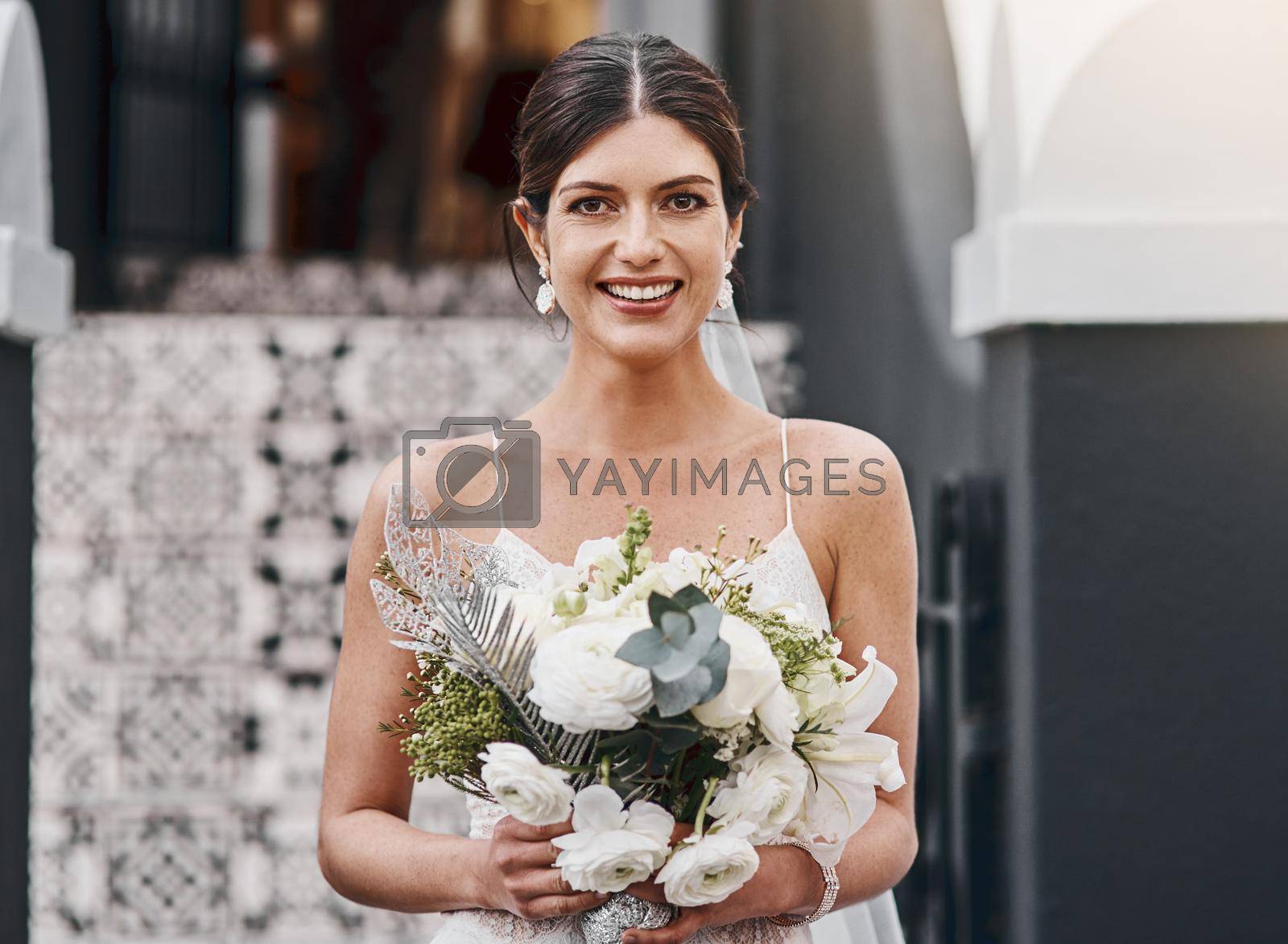 Royalty free image of Today Im marrying my soulmate. a beautiful bride standing outside. by YuriArcurs