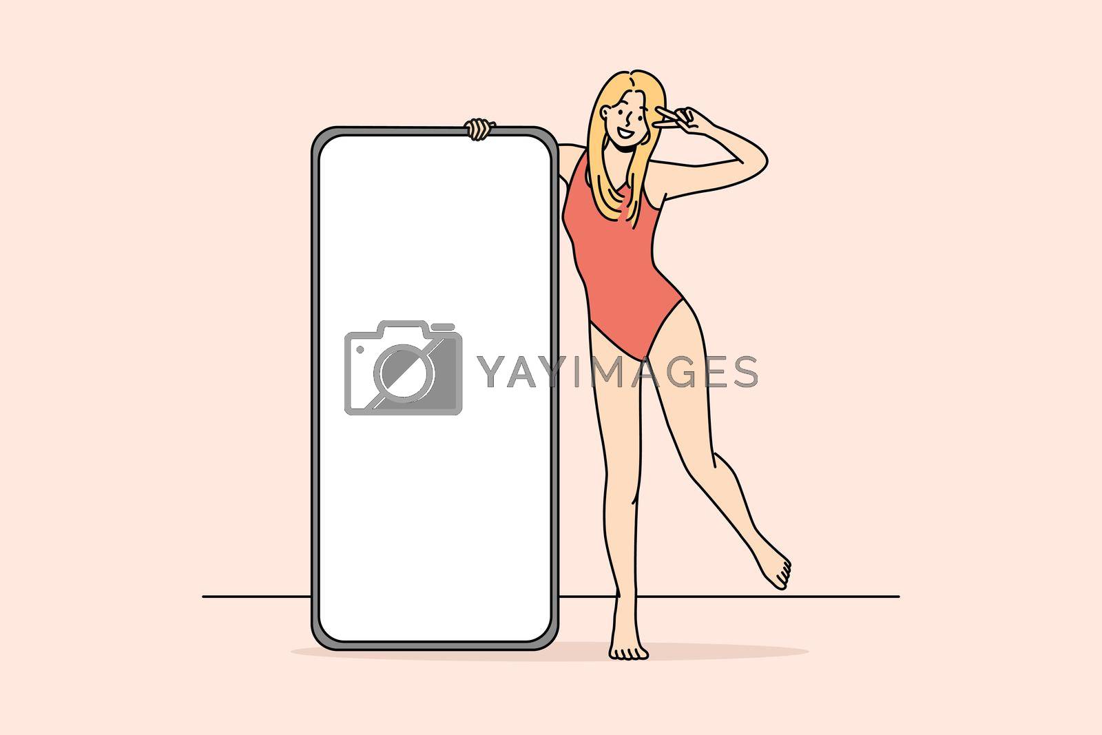 Royalty free image of Smiling girl posing near cellphone by VECTORIUM