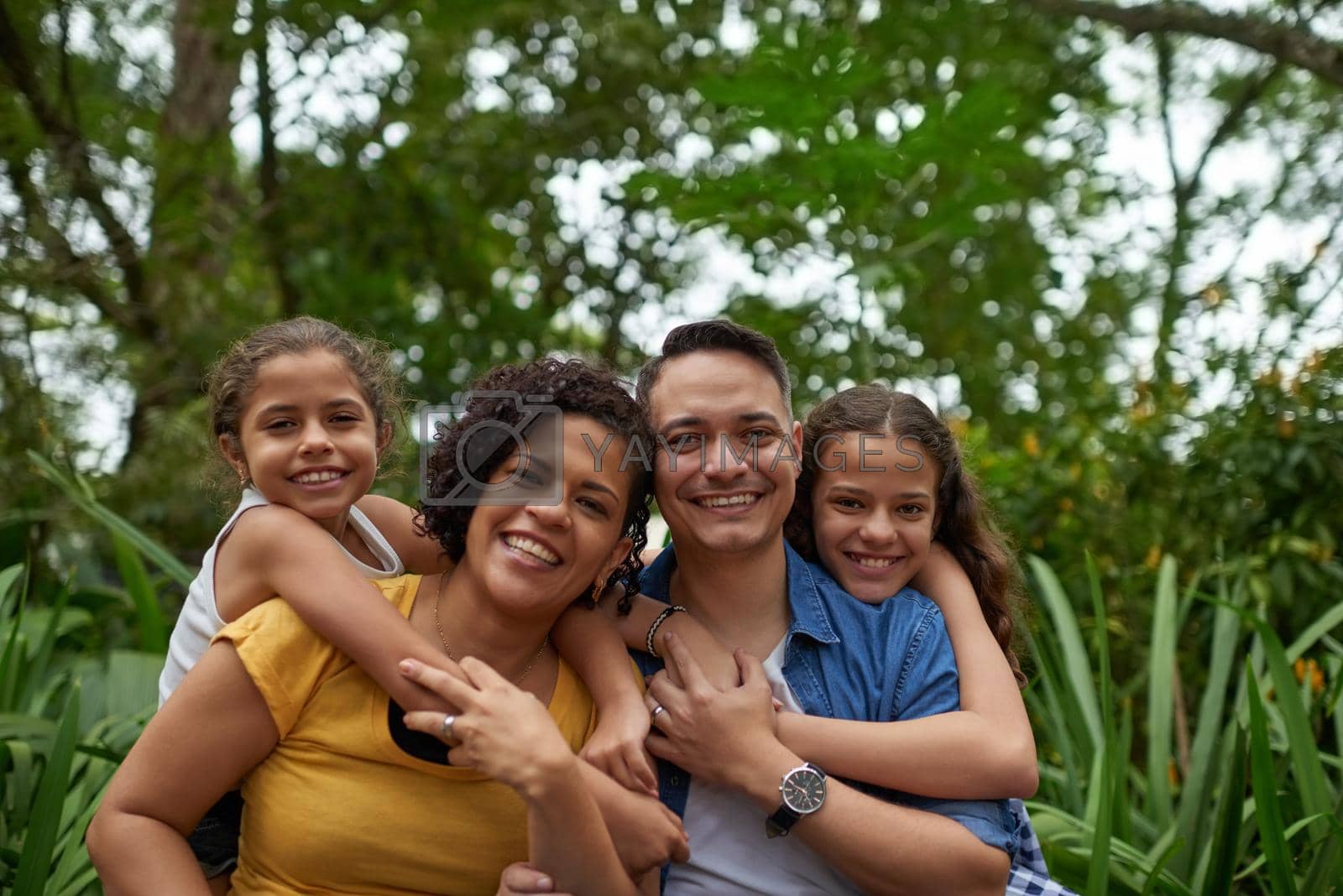 Royalty free image of True love I think you mean family. Cropped portrait of a happy family spending some time together at the park. by YuriArcurs