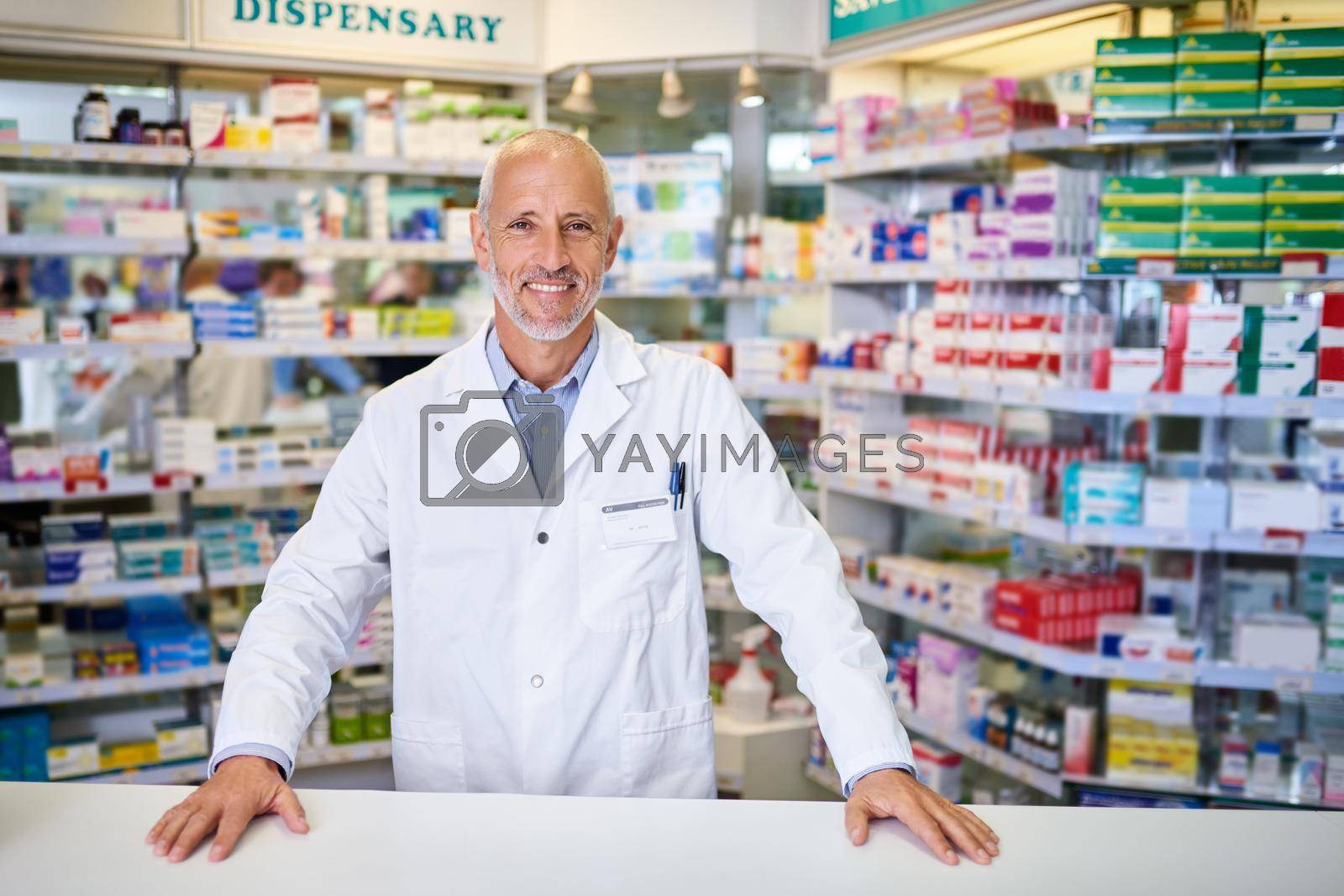 Royalty free image of Always ready to provide sound healthcare advice. Portrait of a mature pharmacist working in a chemist. by YuriArcurs