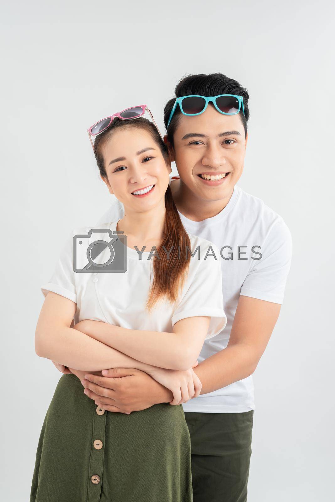 Royalty free image of happy couple embracing, isolated on white background, man in glasses, Positive emotion facial expression by makidotvn