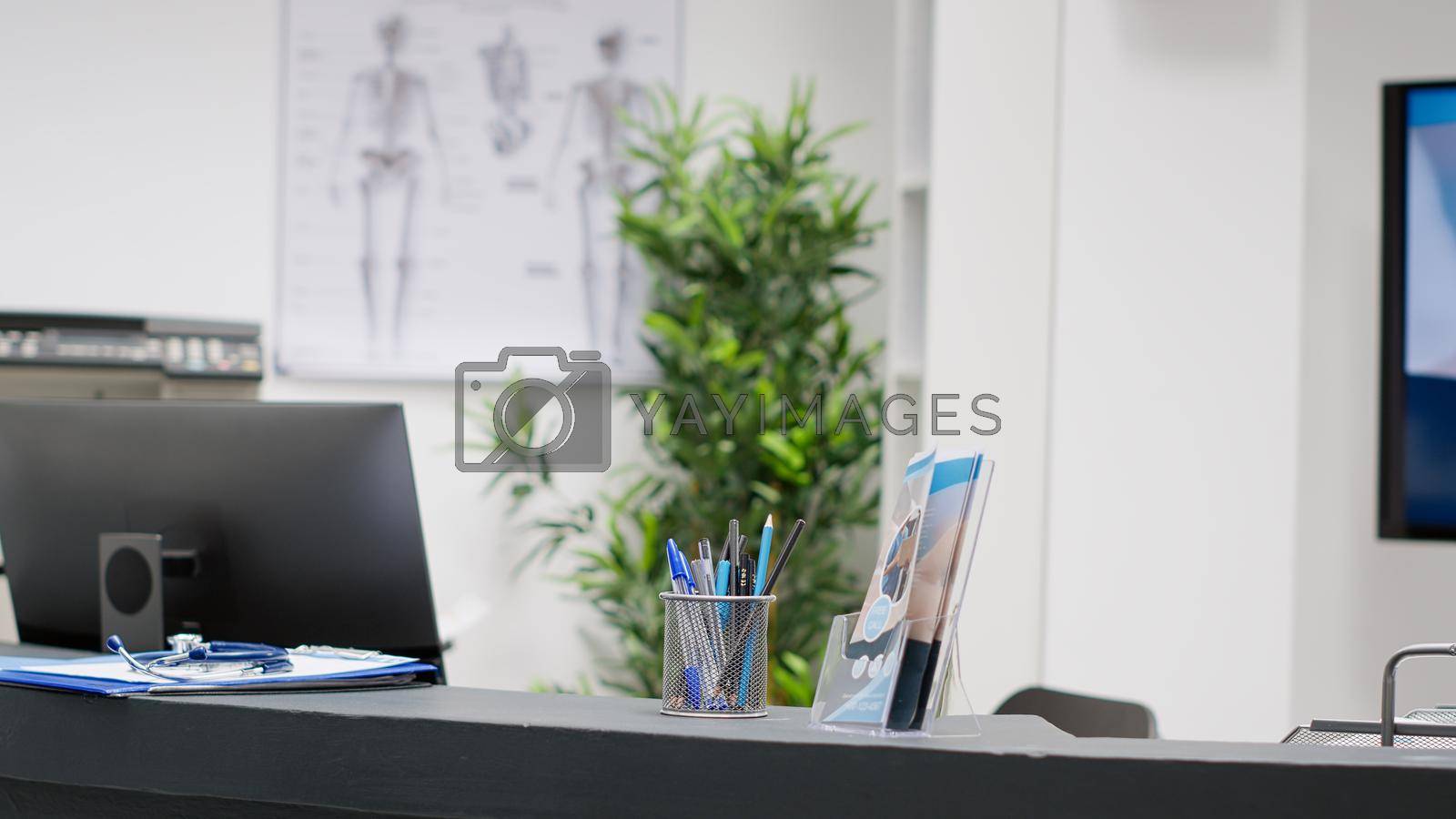 Royalty free image of Empty hospital reception counter at emergency clinic by DCStudio