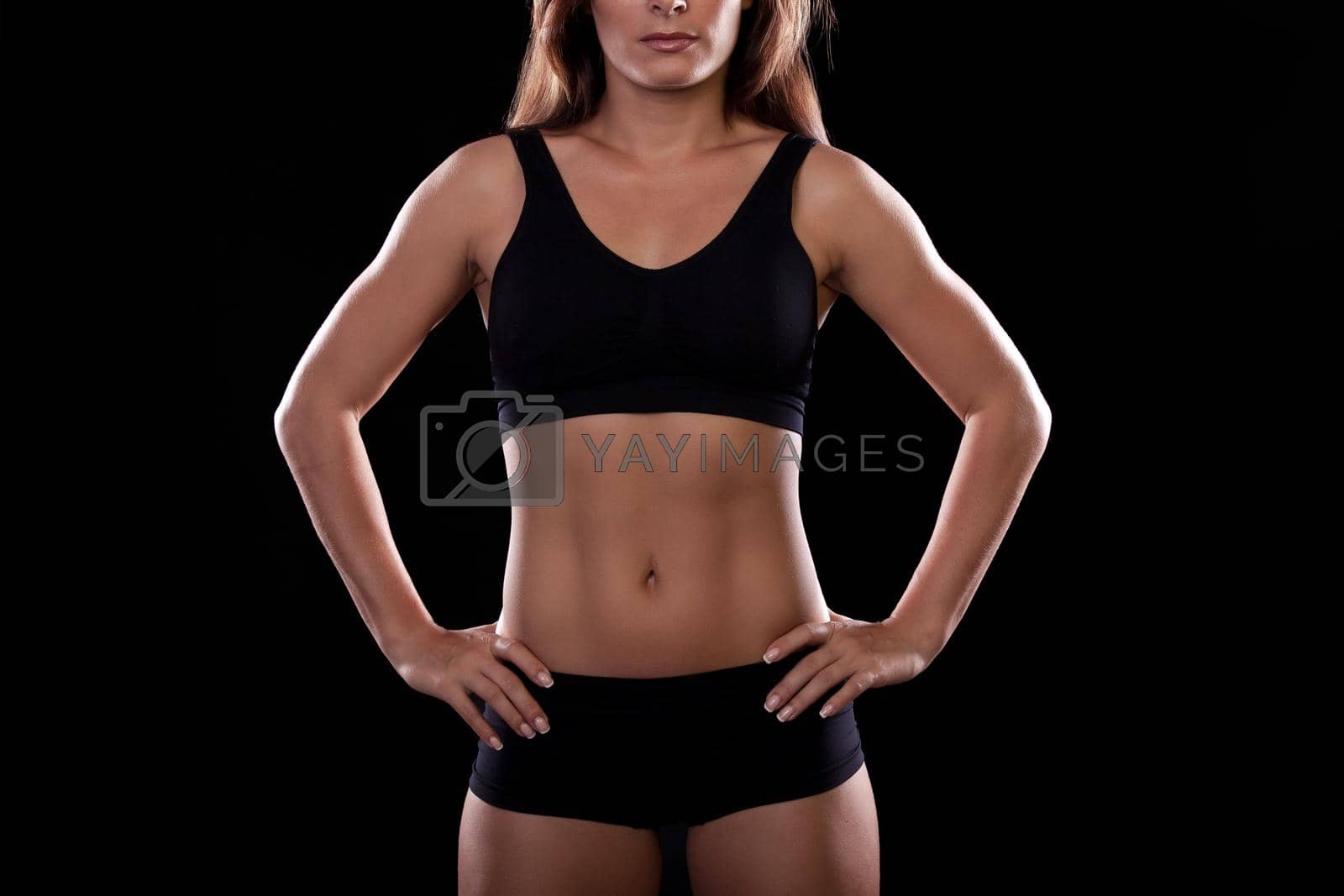 Royalty free image of Torso of a girl on a black background by studiodav