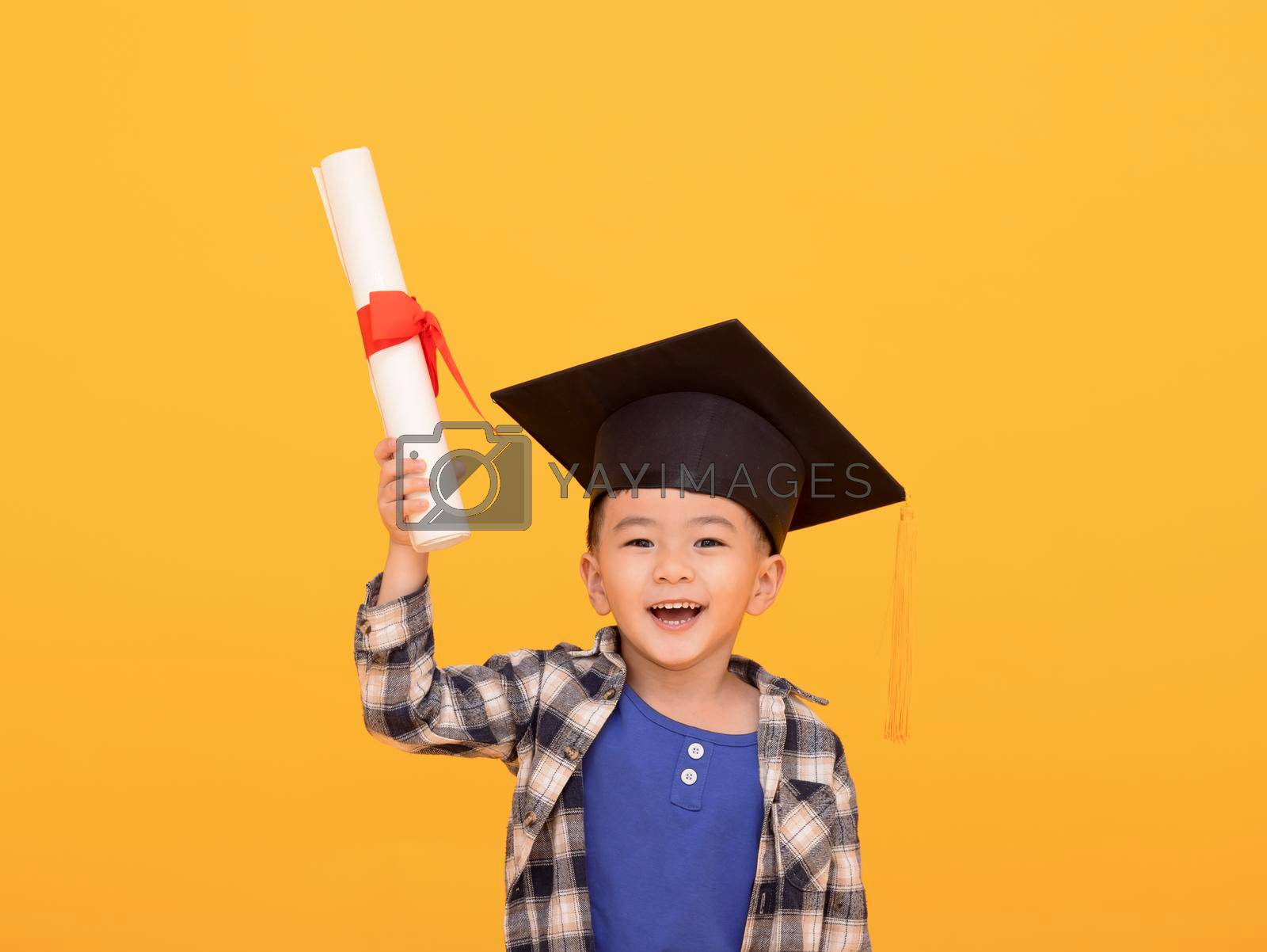 Royalty free image of Happy Asian school kid graduate in graduation cap by tomwang