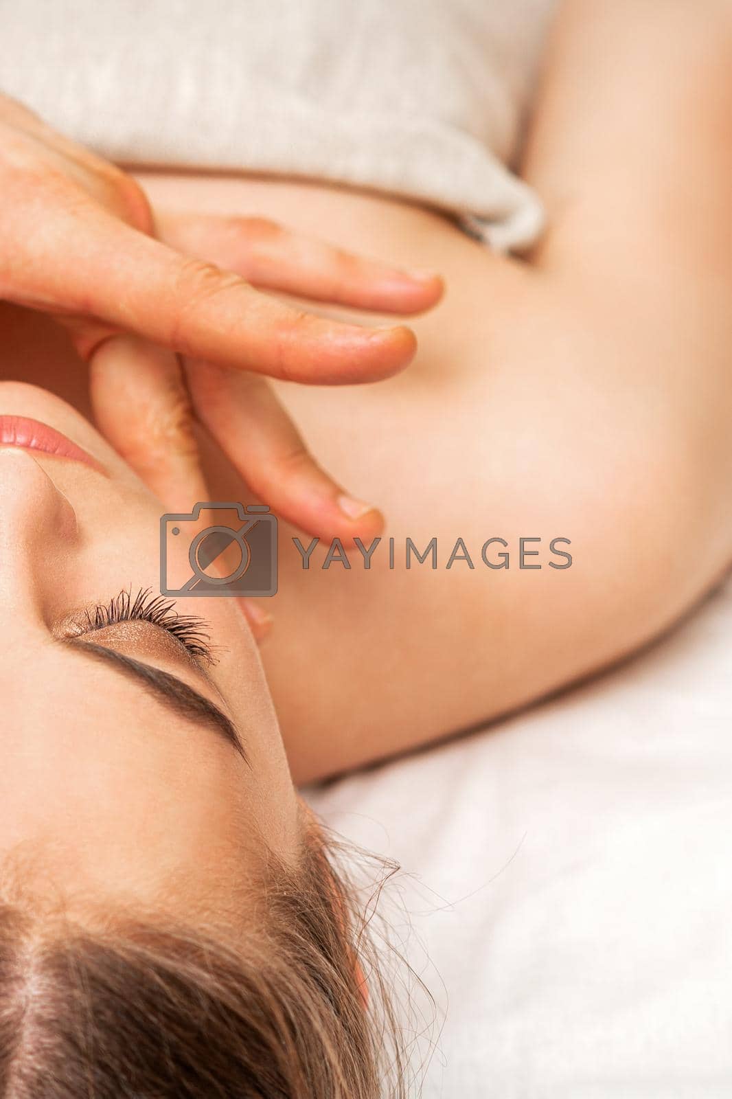 Royalty free image of Chin or neck massage of woman by okskukuruza