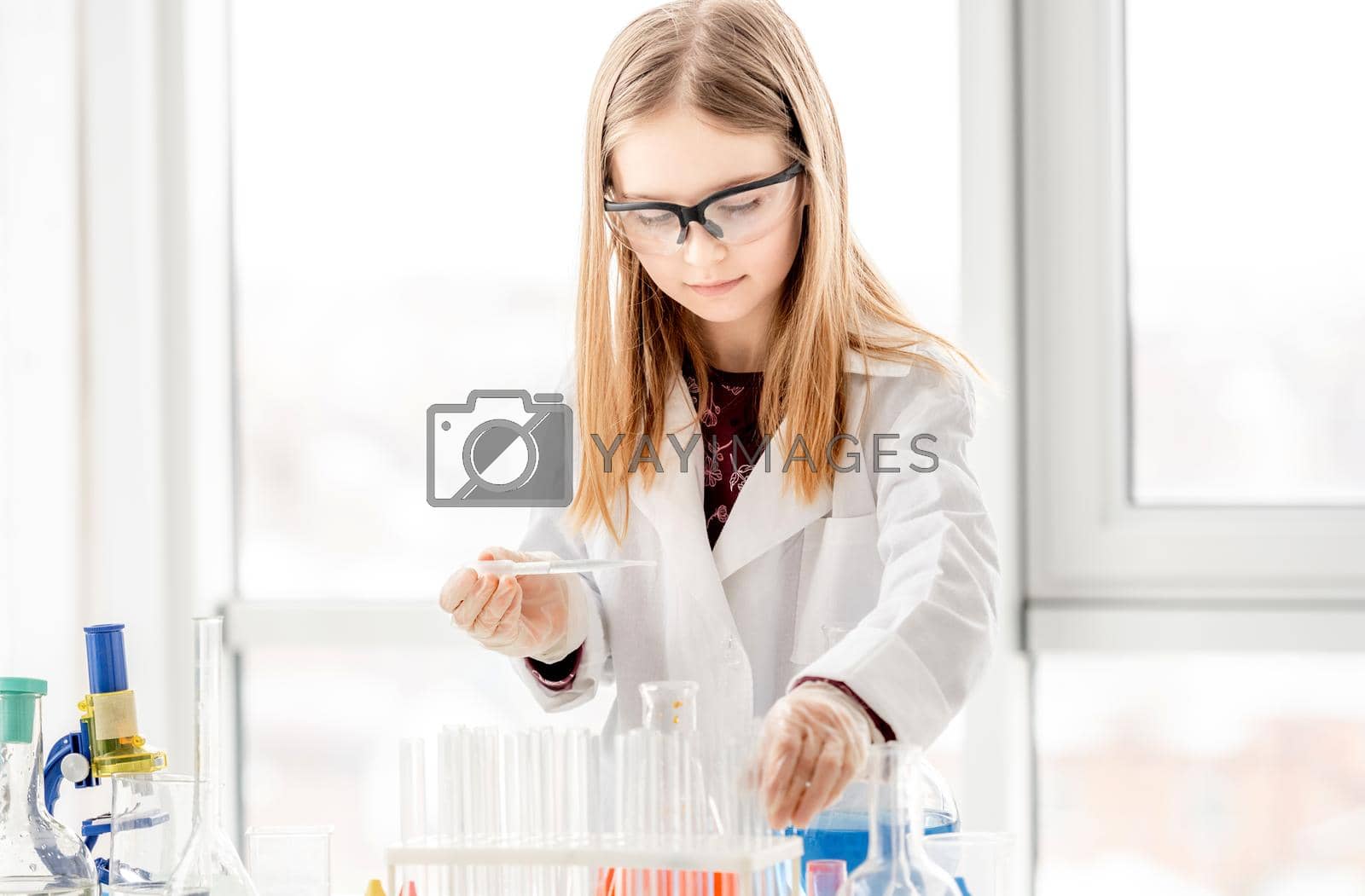 Royalty free image of Girl on chemistry lesson by tan4ikk1