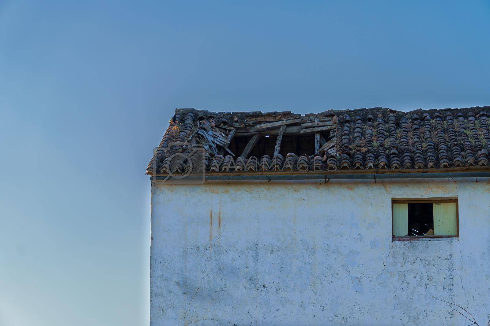 Royalty free image of abandoned house with a collapsed roof by joseantona