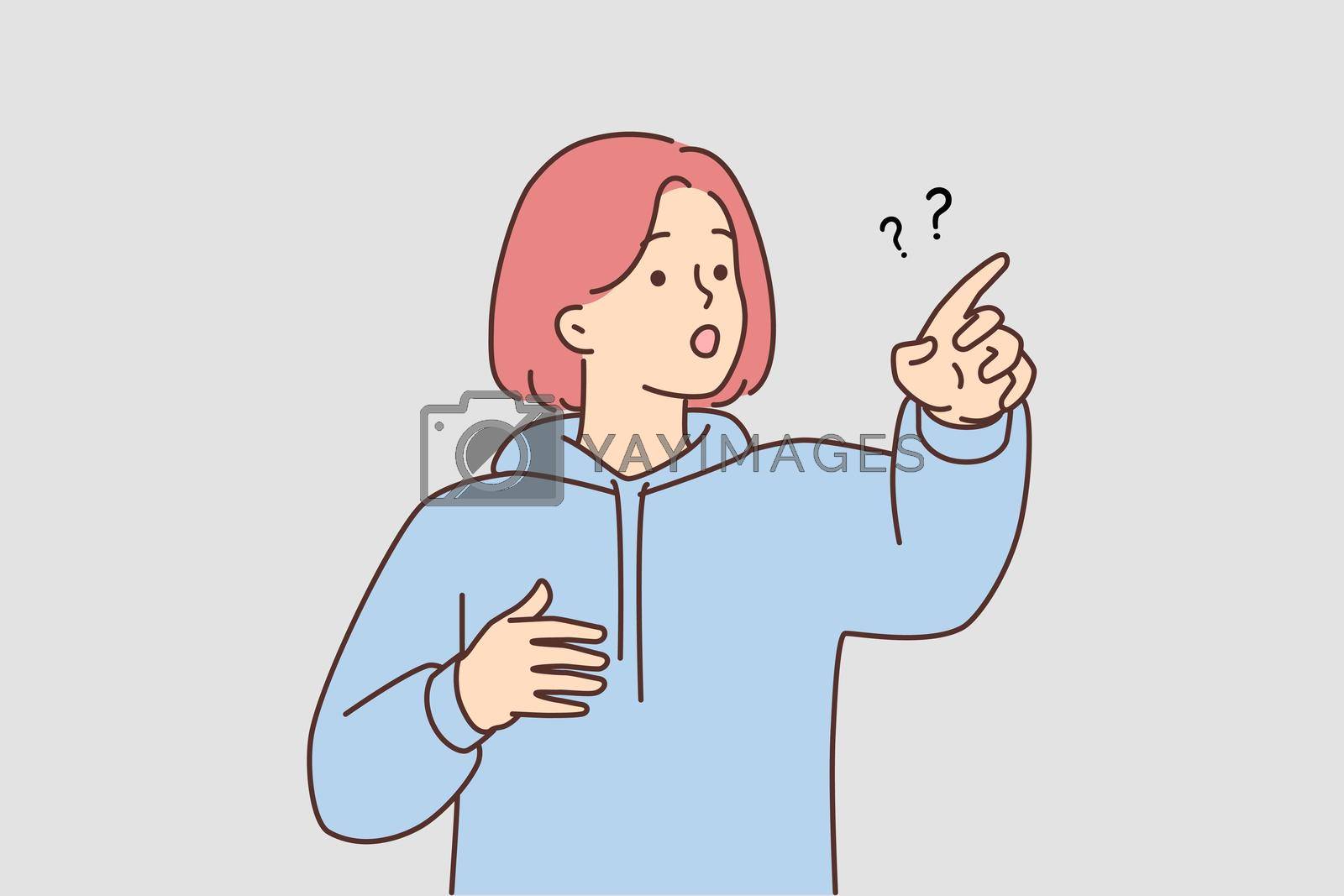 Royalty free image of Frustrated girl point with finger at something by Vasilyeu