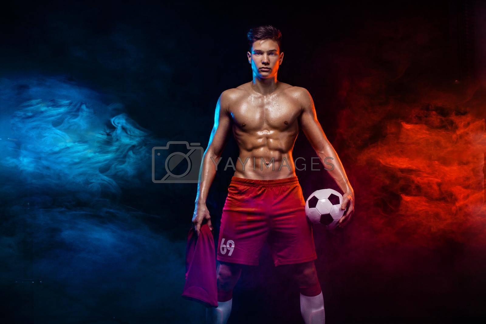 Royalty free image of Teenager - soccer player. Boy in football sportswear after game with ball. Sport concept. by MikeOrlov