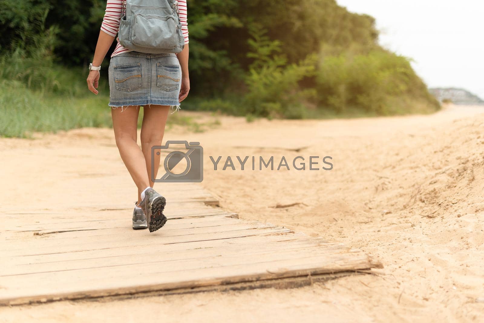 Royalty free image of Traveling woman walking along sandy beach. Cantabria by ivanmoreno