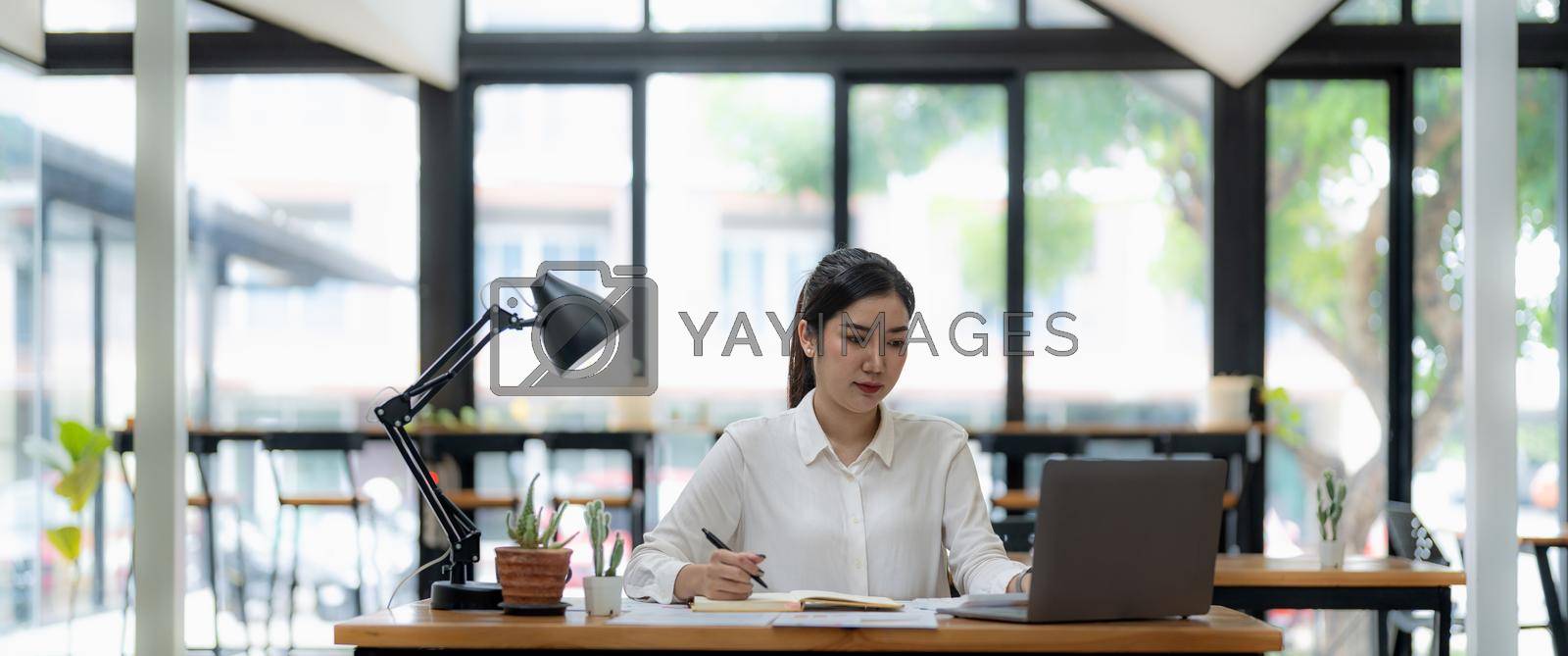Business woman working in finance and accounting Analyze financial budget in the office. banner shot.