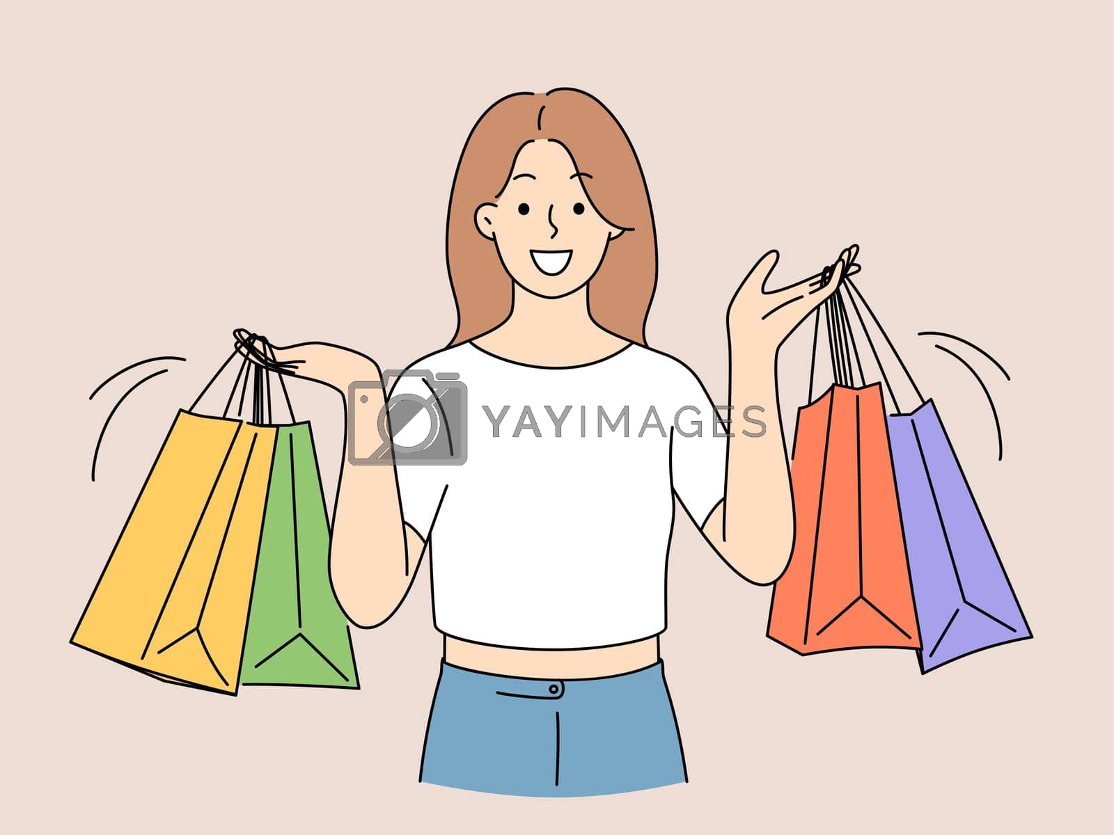 Royalty free image of Smiling woman with shopping bags by Vasilyeu