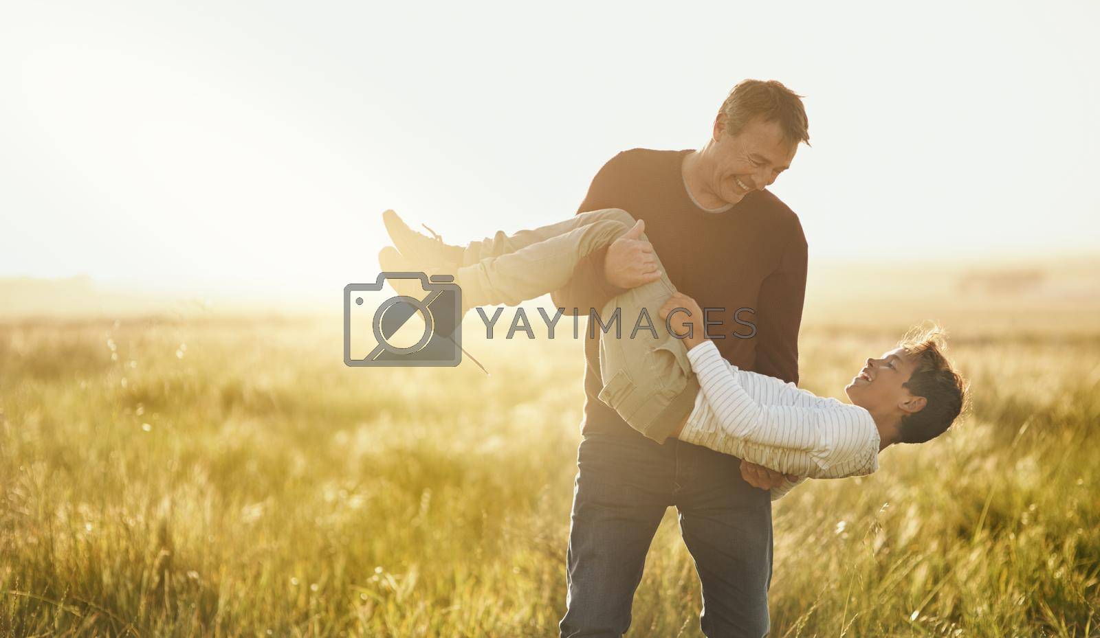 Royalty free image of Outdoor time is good for the whole family. a father and son having a good time outdoors. by YuriArcurs