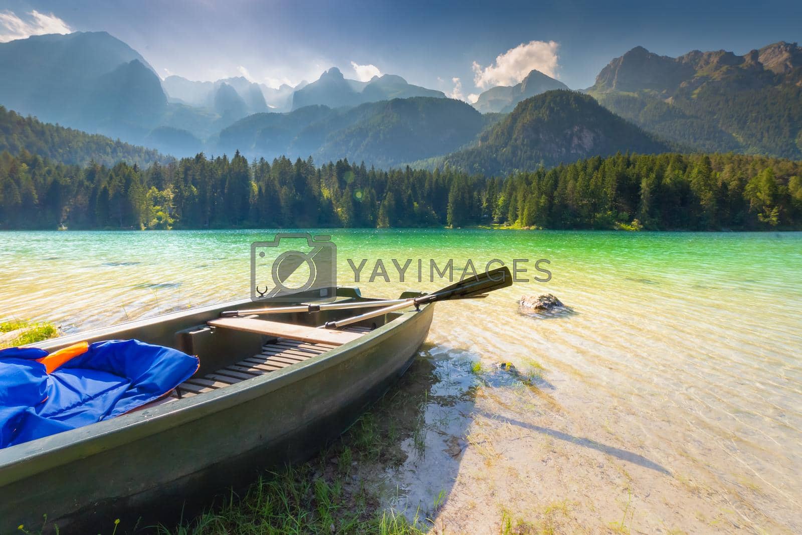 Royalty free image of Boat anchored in Lake Tovel reflection in Trentino-Alto Adige, Dolomites, Italy by positivetravelart