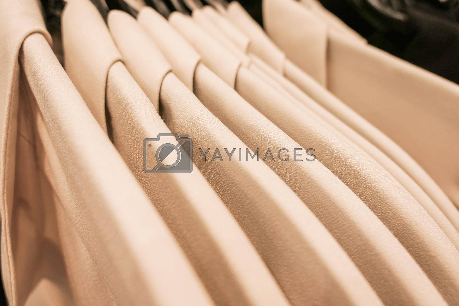 Royalty free image of Fashionable casual clothes in a boutique store by Anneleven