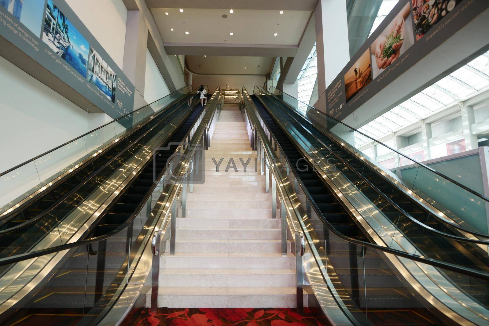 Royalty free image of singapore, Marina bay 12 june 2022. escalator in marina bay sand shopping mall by towfiq007