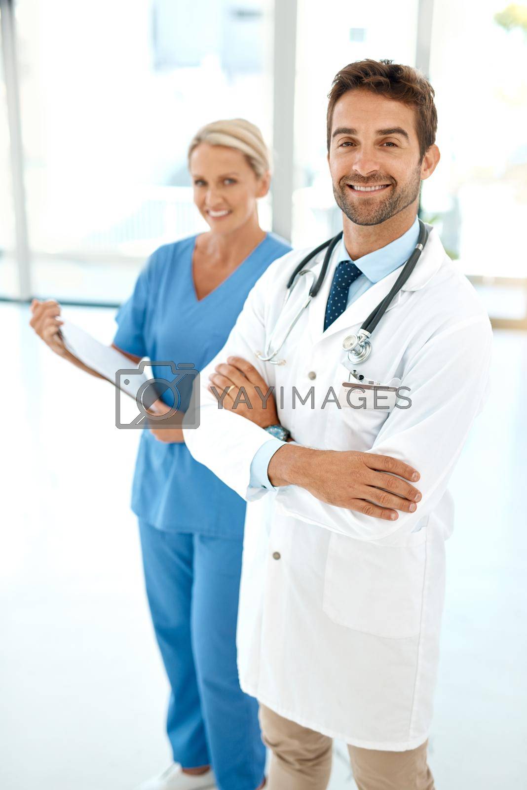 Royalty free image of We save lives, together. Cropped portrait of two happy healthcare practitioners posing together in a hospital. by YuriArcurs
