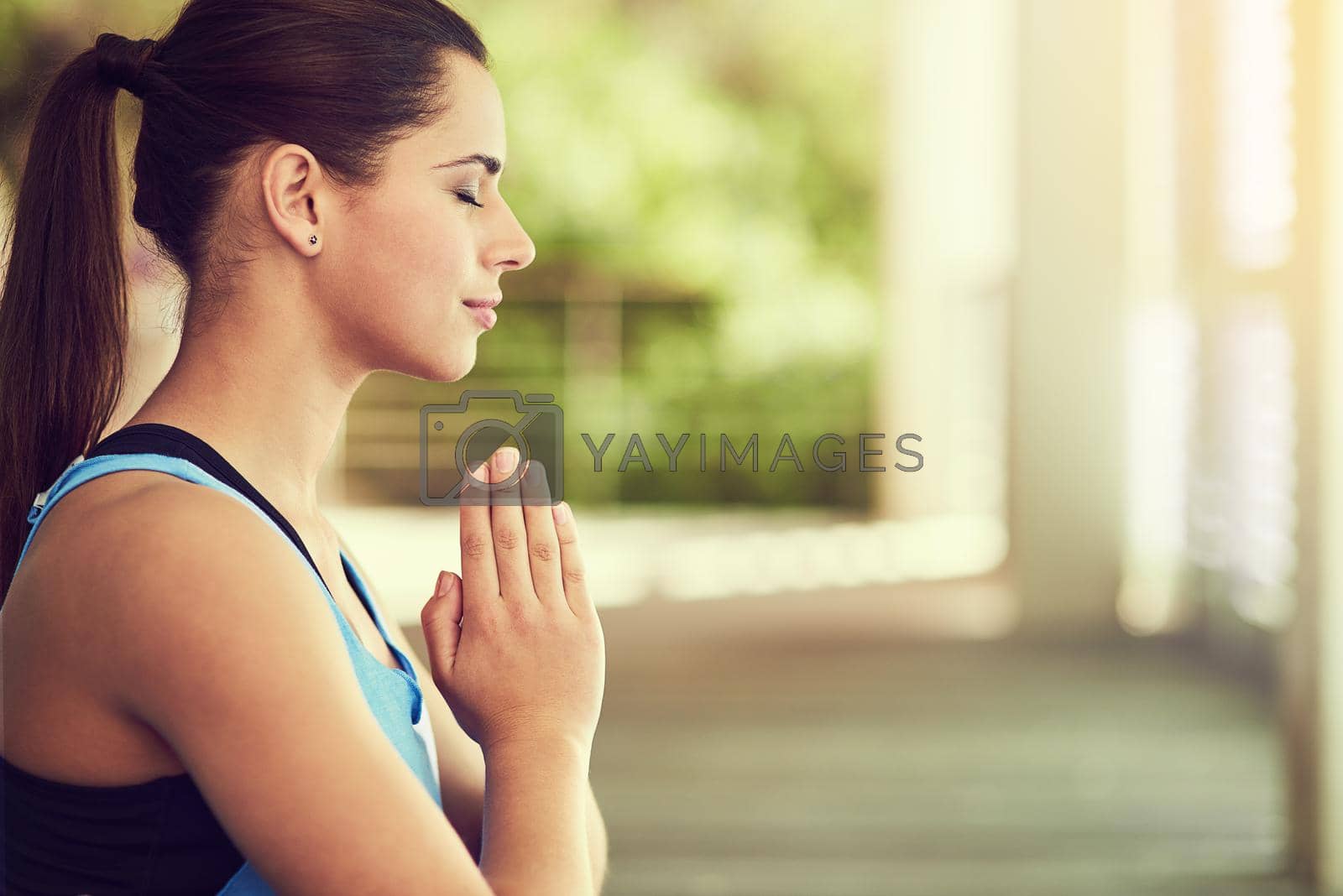 Royalty free image of Find peace in everything you do. a young woman practising yoga. by YuriArcurs